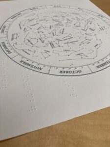Tactile graphic with braille indicating the location of constellations.